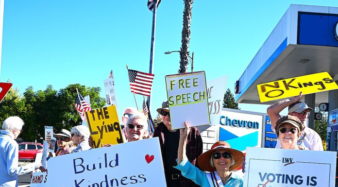 Protesters line both sides of Los Gatos Boulevard for “No Kings” rallies protesters