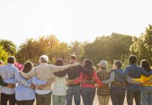 stock image of a bunch of people together looking forward
