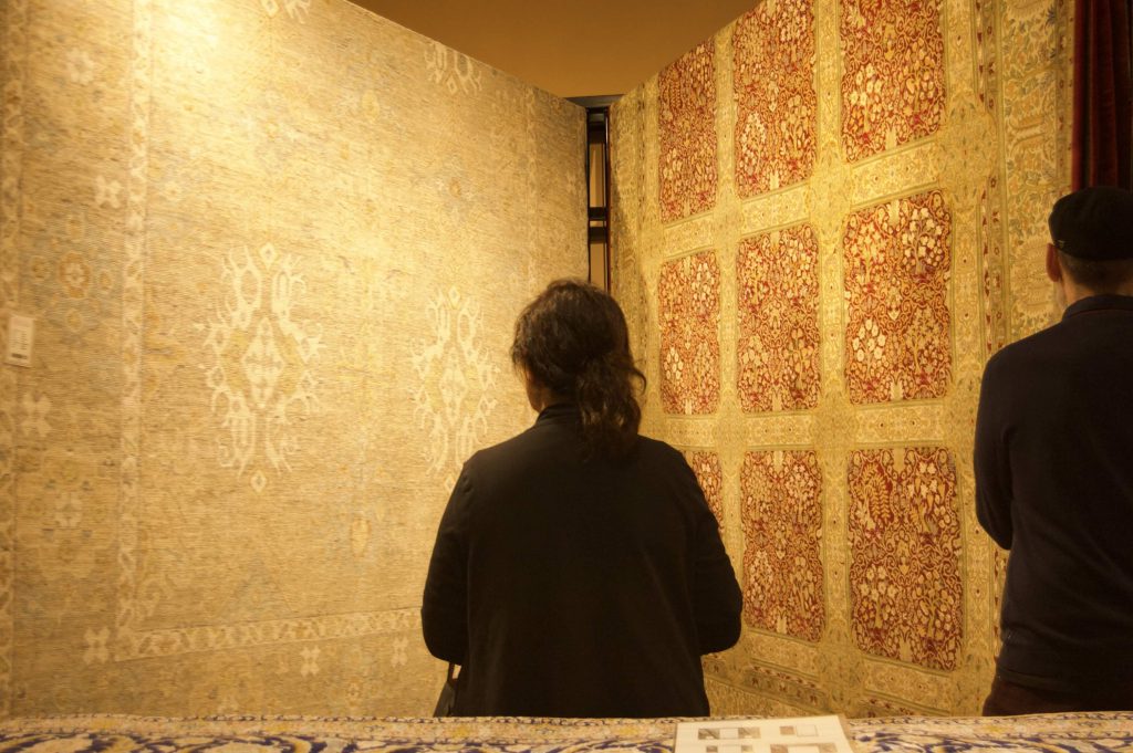 shopper considers rugs