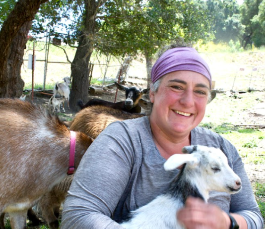 Shoshana Ohriner holds a small goat