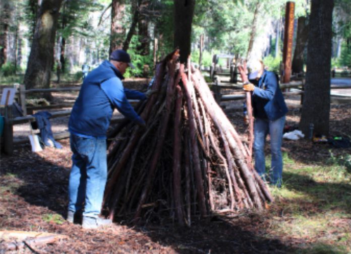preparing a pile to burn in Big Basin