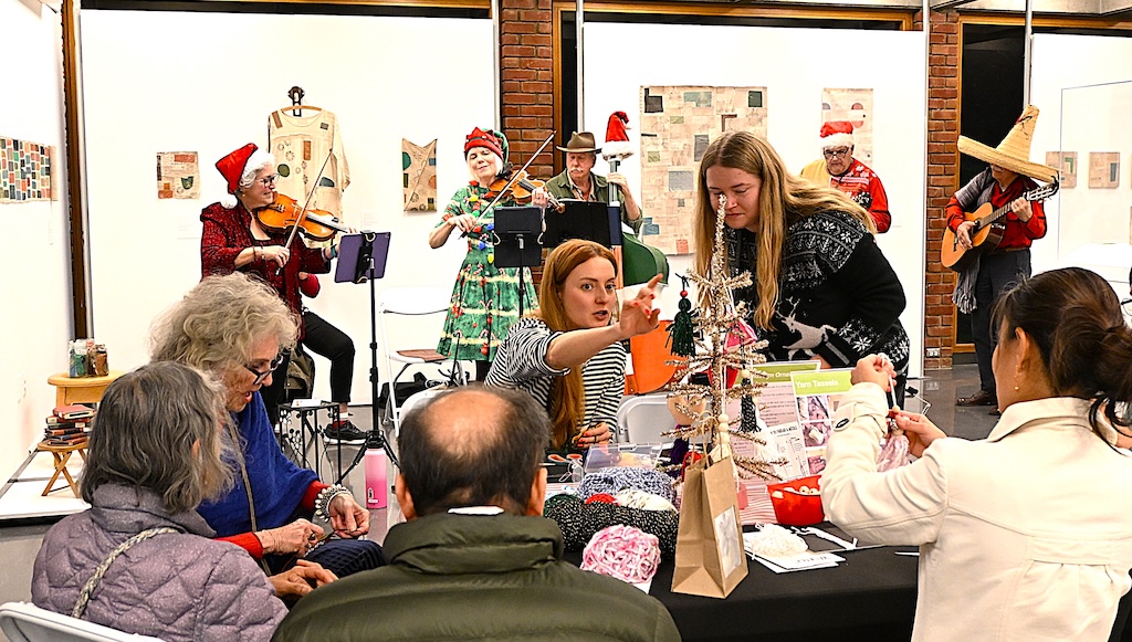 fiddlers play as crafting is underway