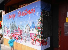 Temporary mural at cafe crash site along Main St. to proclaim LG is ‘Stronger Together’ before the mural was this plastic