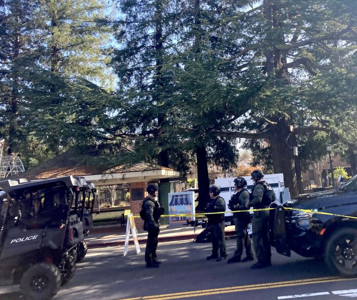 Police in military-style gear during parade Police in military-style gear in Los Gatos