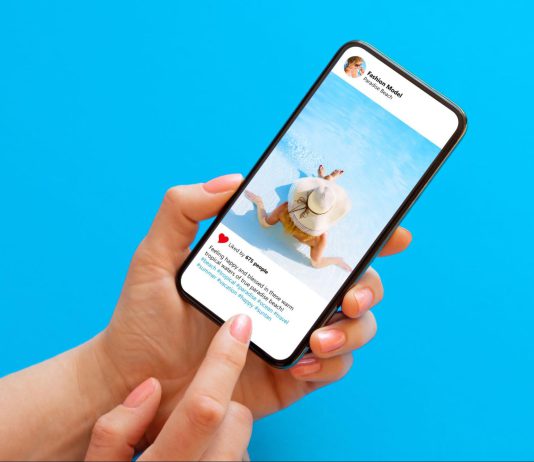 Phone user reading a social media post