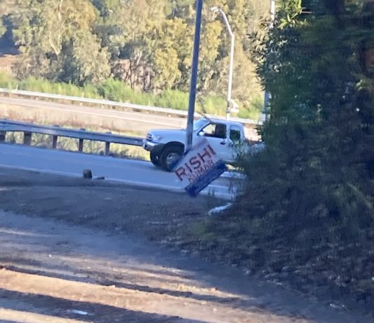 crooked election sign in the Santa Cruz Mountains