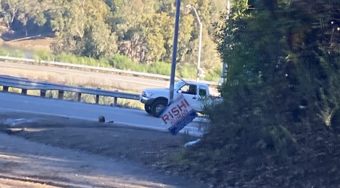 crooked election sign in the Santa Cruz Mountains