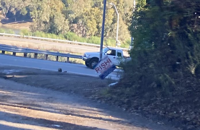 crooked election sign in the Santa Cruz Mountains