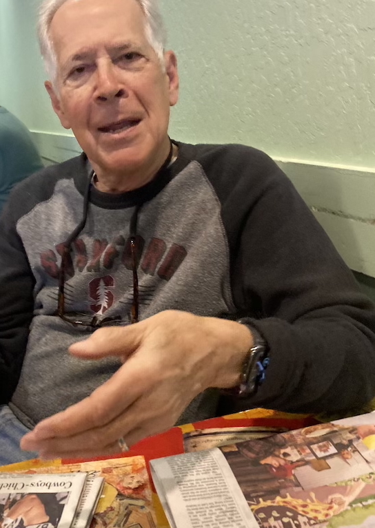 Lon Allan with newspapers