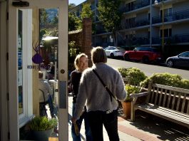 The Purple Onion is turning 20 this year Purple Onion owner holds the door for a customer
