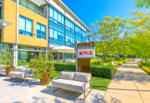 A Netflix building with sign, walkways and landscaping.