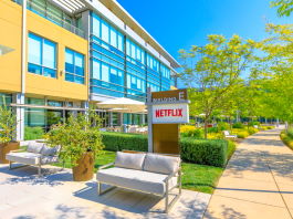 A Netflix building with sign, walkways and landscaping.