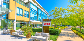 A Netflix building with sign, walkways and landscaping.