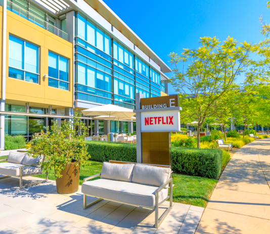 Netflix drops Warner bid, pockets $2.8 billion A Netflix building with sign, walkways and landscaping.