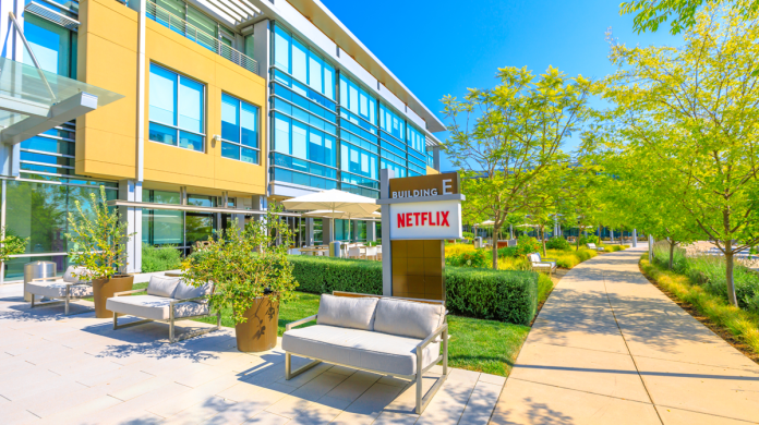 A Netflix building with sign, walkways and landscaping.
