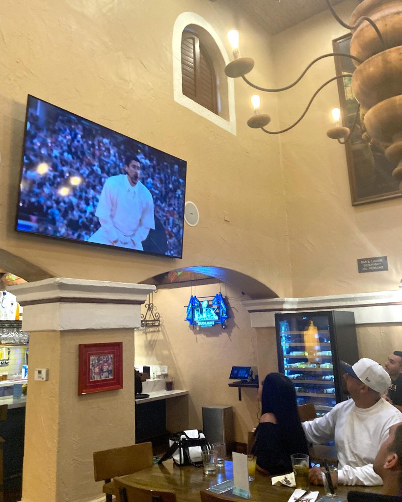 Pedro's customers enjoying Bad Bunny performance on TV