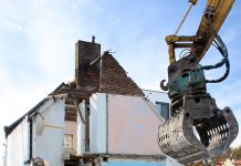 housing being torn apart by a machine