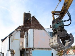 housing being torn apart by a machine