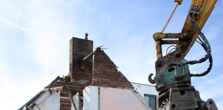 housing being torn apart by a machine