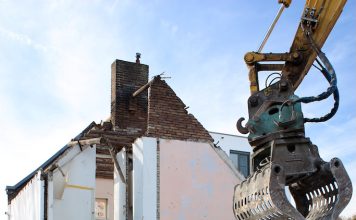 housing being torn apart by a machine