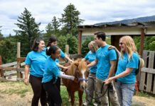 LG Farms counselors with a pony