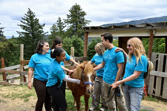 LG Farms counselors with a pony