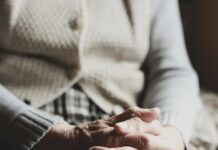 Fraud protection in focus on World Elder Abuse Awareness Day senior clasped hands