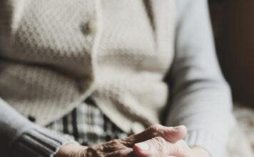 senior clasped hands