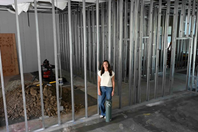 More Than Motherhood1 Melissa Mancini amid construction