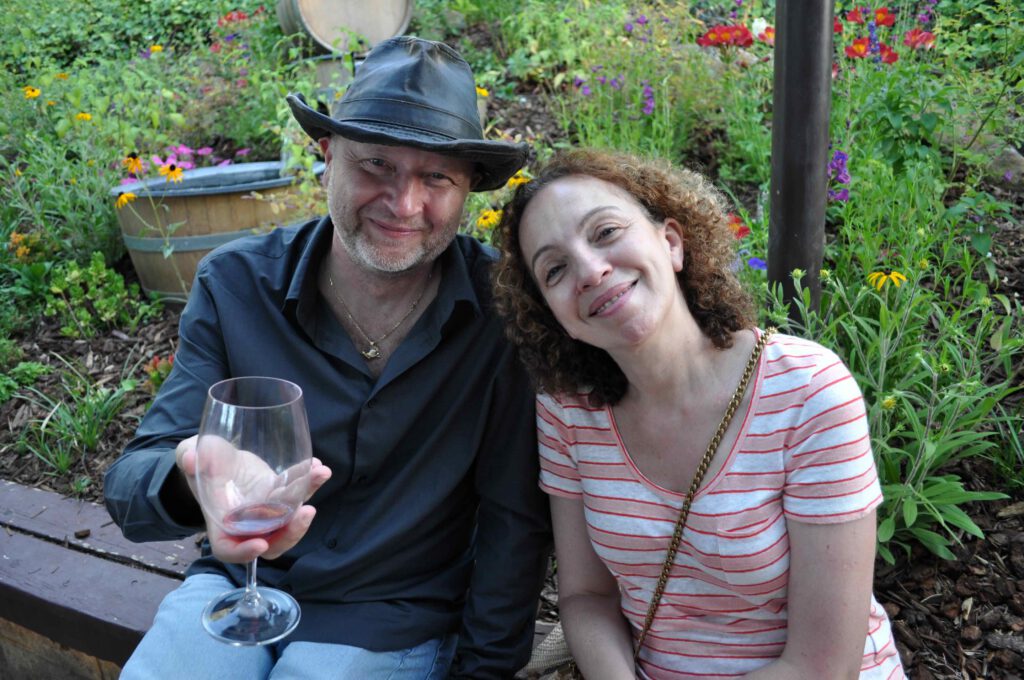 two wine drinkers seated together