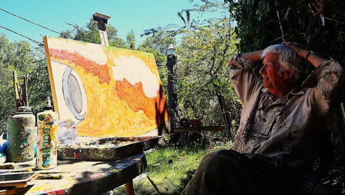 Rudy Rucker in his backyard studio Rudy Rucker in his outdoor studio