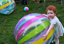 Hitmen, Summit Sisters entertain at ‘Endless Summer’ fundraiser big beach ball and child