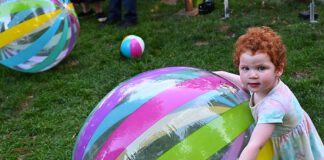 big beach ball and child