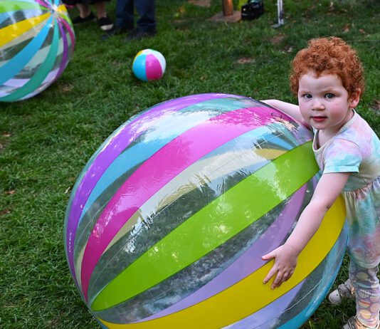 big beach ball and child