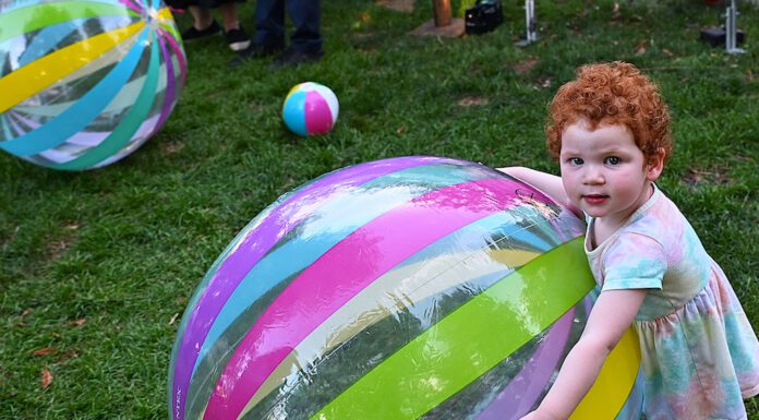 big beach ball and child