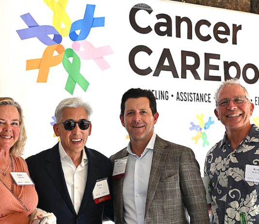 Cancer CAREpoint hosts garden party at Montalvo Arts Center in front of the Cancer CAREpoint banner