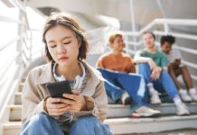 A student’s perspective on the youth mental health crisis Asian student looking somewhat despondent