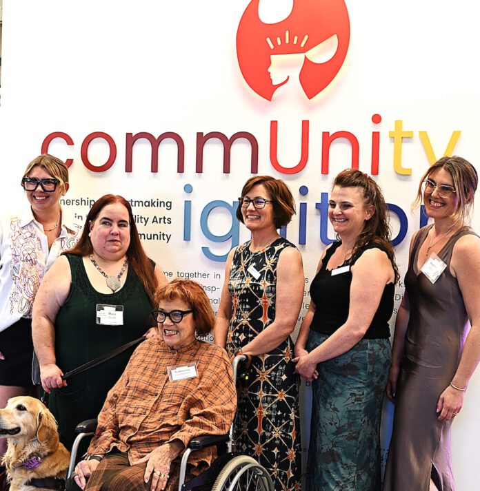 art show opening at NUMU including person in wheelchair