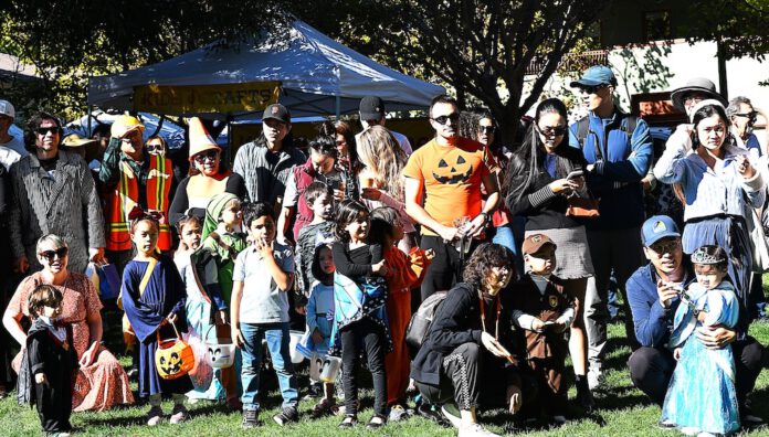 Costumed crowd paraded around Park Plaza Costumed crowd before Halloween