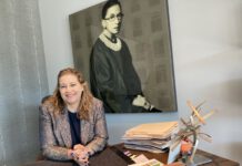 Shannon Hunt-Scott in front of Bader Ginsburg painting